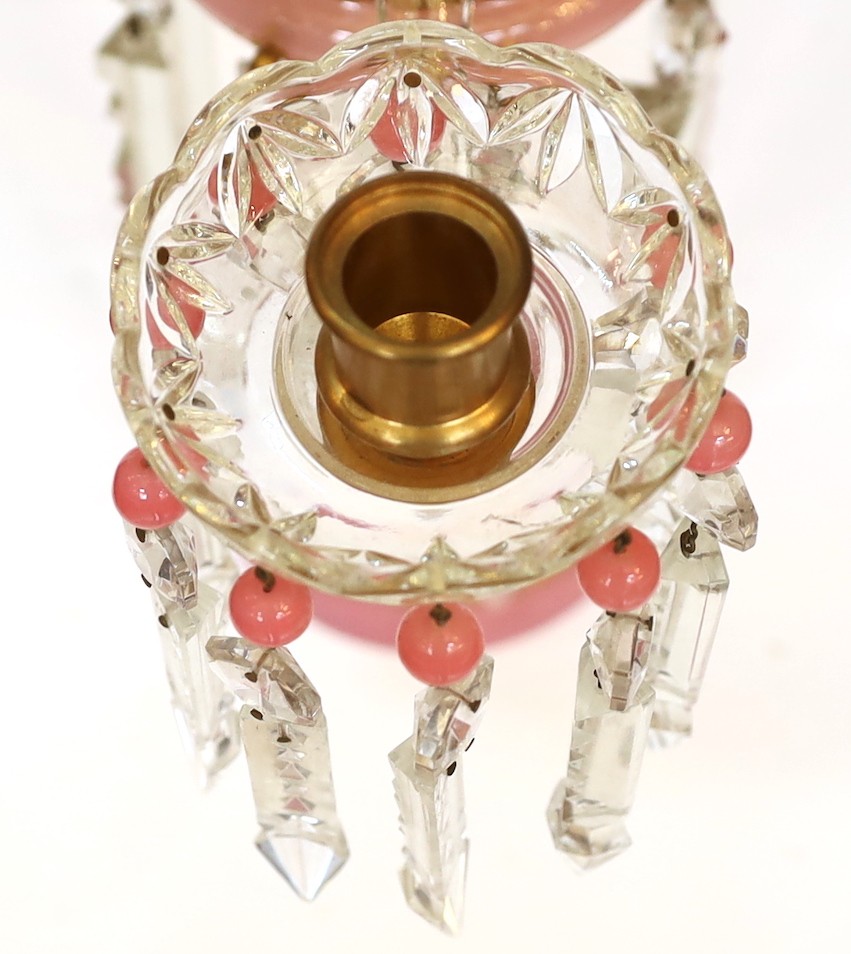 A pair of Victorian opaque pink and white glass lustre candelabra, with spear shaped finials and cut glass scrolling branches, height 52cm